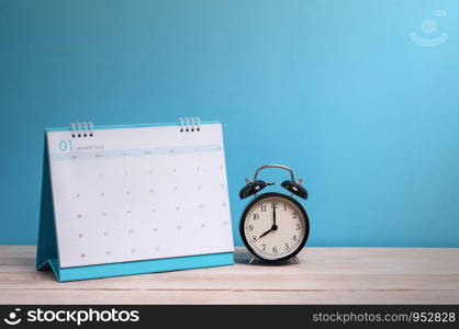 Vintage clock and calendar on wood, time concept