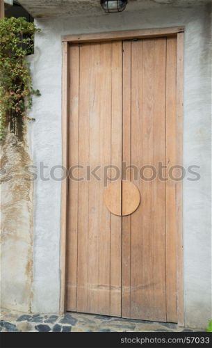 Vintage closed wooden door of house, stock photo