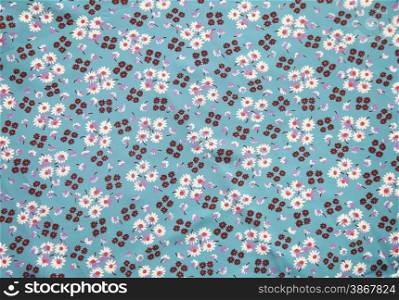 vintage cloth with flower print in blue, brown, lilac and orange