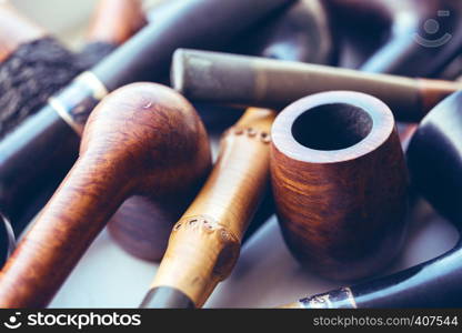 vintage collection of tobacco pipes