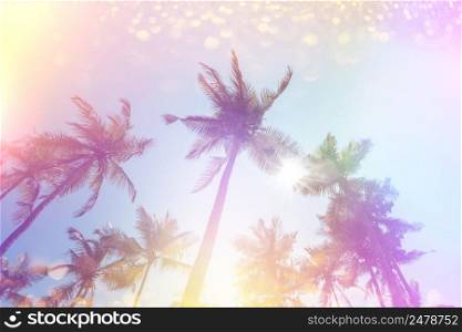 Vintage color stylized tropical palms with retro film light leaks and golden glitter