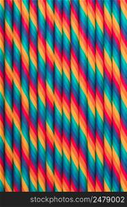 Vintage colored paper straws abstract background