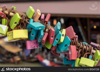 Vintage colorful lock with rusty in travel at Thailand.