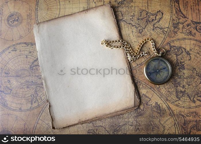 Vintage compass lying on old map