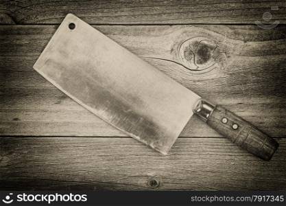 Vintage concept of an large old traditional butcher knife on rustic wood &#xA;&#xA;