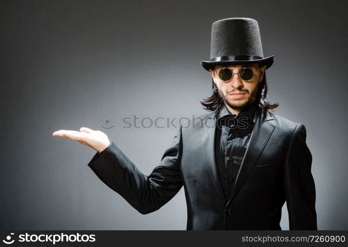 Vintage concept with man wearing black top hat