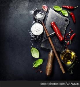 Vintage cutlery and fresh ingredients on dark background