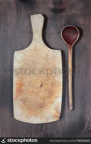 Vintage cutting board with space for text and wooden spoon