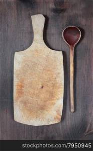 Vintage cutting board with space for text and wooden spoon