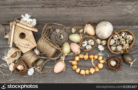 vintage decoration with eggs and flower bulbs. nostalgic easter still life home interior. wooden background