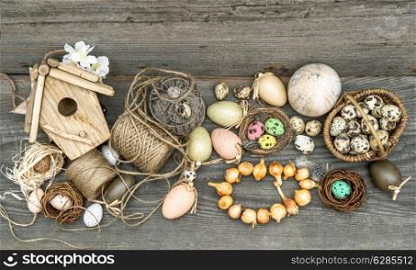 vintage decoration with eggs and flower bulbs. nostalgic easter still life home interior. wooden background