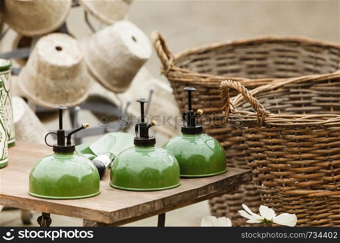 Vintage decorations, antique design objects concept. Old fashioned ceramic clay green kettle. Old fashioned ceramic clay green kettle