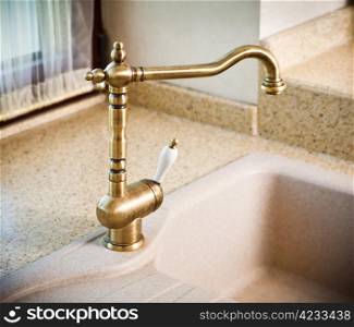 Vintage faucet in a kitchen sink