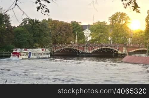 Vintage ferry with people on the german river in Berlin