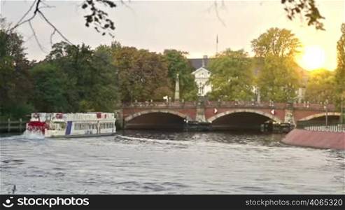 Vintage ferry with people on the german river in Berlin