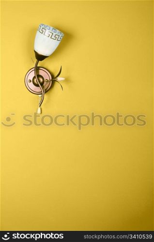 Vintage flower electric lamp over the blank yellow background