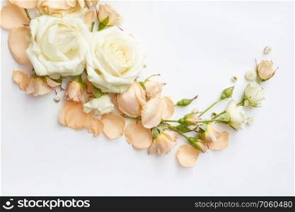 Vintage frame from different flowers on a white background, flat lay. frame of flowers