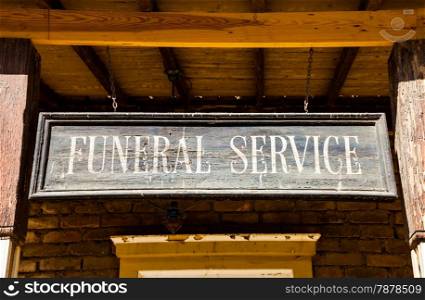 Vintage Funeral Service cartel made of wood. Good for concepts.