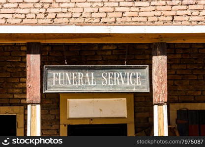 Vintage Funeral Service cartel made of wood. Good for concepts.