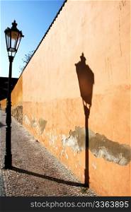 Vintage gas-lamp reflecting on the wall