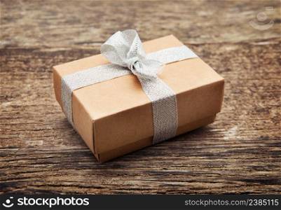 Vintage gift box on old wooden background.