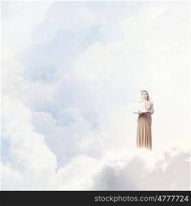 Vintage girl with laptop. Young lady standing on cloud and using laptop