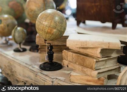 Vintage Globes of Various Sizes on a Table.. Vintage Globes of Various Sizes on a Table