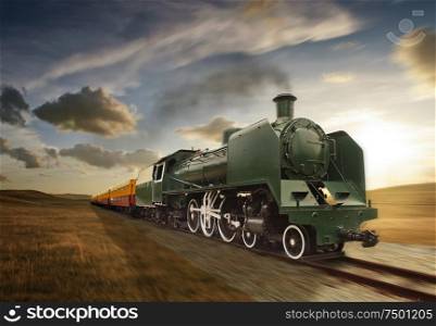 vintage green and yellow steam powered railway train moving