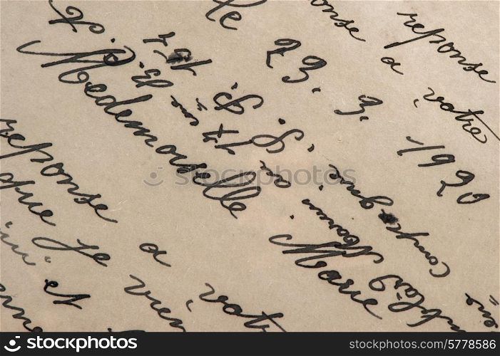 vintage handwriting with a text in undefined language. grunge paper background