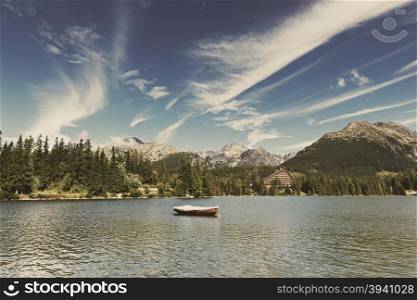 Vintage image of alpine mountain lake