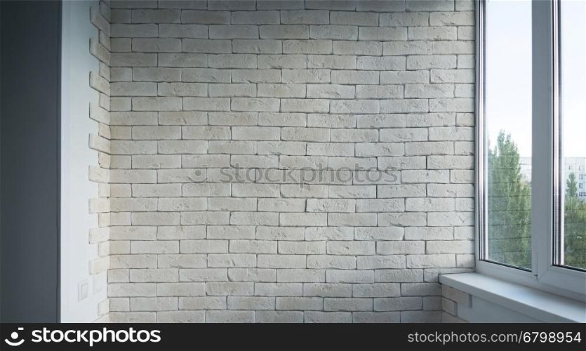 Vintage interior of white brick wall and old wooden floor. Empty vintage room