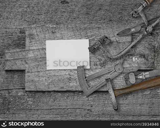 vintage jeweler tools and diamond over wooden bench, blank card for your business