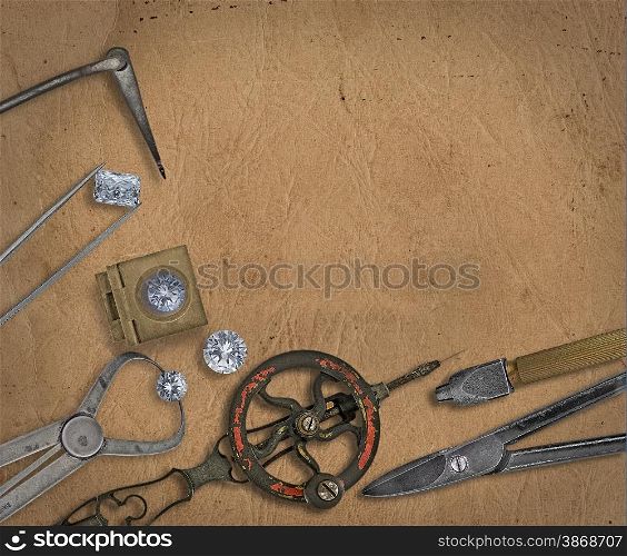 vintage jeweler tools and diamonds over working bench, blank space for your text
