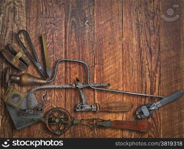 vintage jeweler tools over wooden working bench, space for text