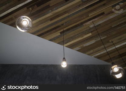 Vintage light bulbs hanging from ceiling, stock photo