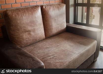 Vintage living room interior with brown sofa, stock photo