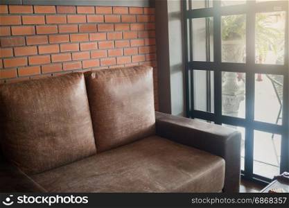 Vintage living room interior with brown sofa, stock photo