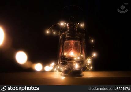 Vintage magic lantern with lights at night