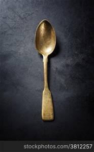 Vintage metal spoon on dark background