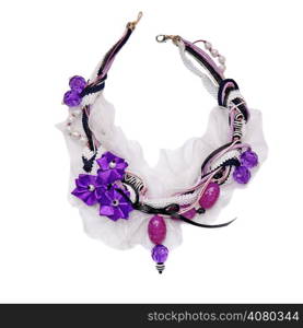 Vintage necklace decorated with beads, braid, laces and purple satin flowers