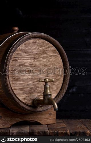 Vintage oak barrel on wooden table still life