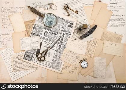 Vintage office tools, old letters, newspapers and postcards
