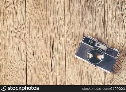 vintage old film camera on wood board with copy space