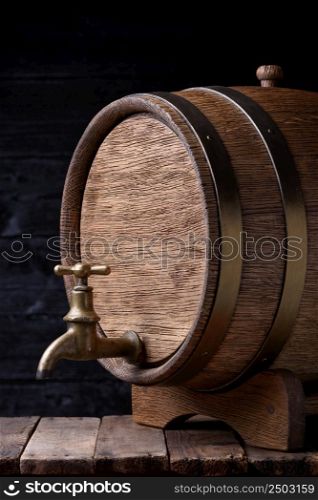 Vintage old oak barrel on wooden table still life