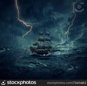Vintage, old sailing ship lost in the ocean in a rainy, stormy night with lightnings in the sky. Adventure and journey concept
