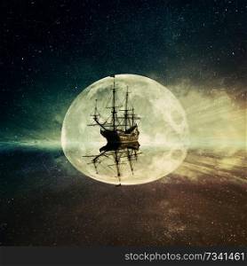 Vintage, old ship floating in the ocean floating on a moonlight night starry sky background. Adventure and journey concept
