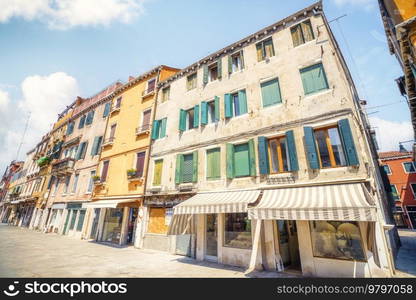 Vintage old street with beautiful buildings in the summer in Venice Italy