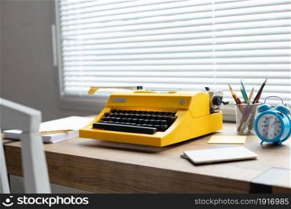 Vintage old typewriter at wood desk table. Writer or study creative concept