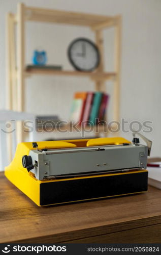 Vintage old typewriter at wooden desk table. Writer or screenwriter creative concept