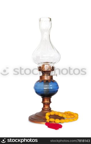 Vintage oriental gas or oil lamp with turkish amber rosary on white background